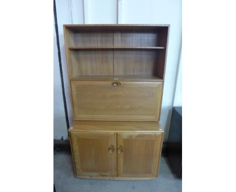 An Ercol Blonde elm Windsor writing cabinet/bookcase 