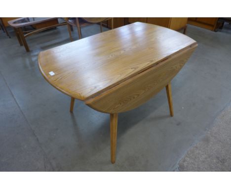 An Ercol Blonde ash and beech Windsor drop-leaf table 