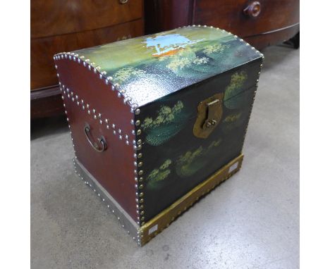 A small painted wooden dome topped trunk 