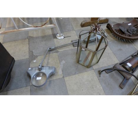 An industrial anglepoise magnifier work lamp and a steel lantern 