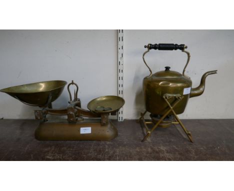 A set of Avery scales with four weights and a brass spirit kettle on stand 