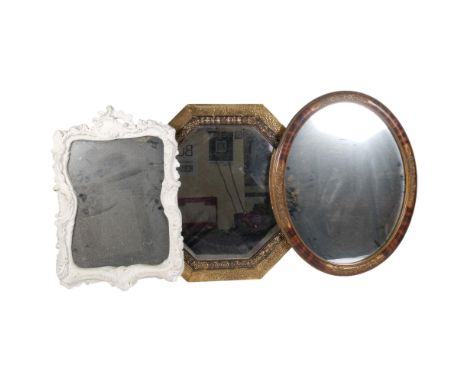 Vintage octagonal mirror in embossed brass frame, 54cm, an oval mirror, and another in painted white plaster frame