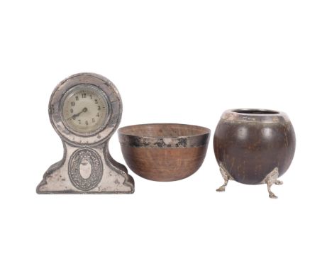 A George V silver-mounted coconut cup, on 4 feet, H10cm, a silver-mounted coconut bowl, diameter 12cm, and an Edwardian oak a