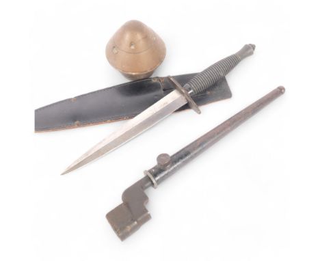 A British 2nd pattern Commando dagger, with ribbed handle, steel blade etched J Nowill &amp; Sons, Sheffield, with leather sc