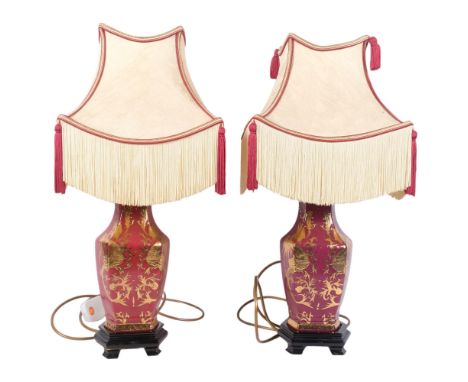 A pair of Oriental ceramic hexagonal lamps, with gilded decoration and matching shades, H51cm