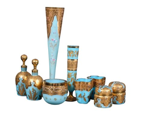 A pair of Vintage blue milk glass bottles and stoppers, with elaborate gilded decoration, matching boxes, a similar vase with