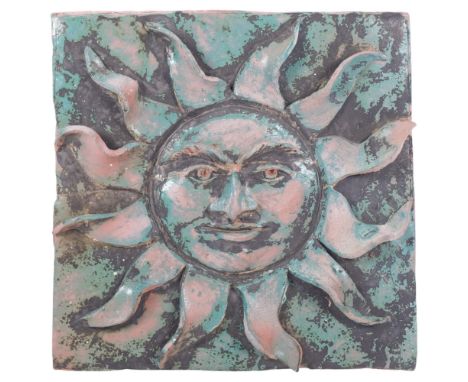 A Vintage terracotta sunburst zodiac style terracotta wall plaque, unsigned, 30cm x 30cmThe terracotta plaque has been comple
