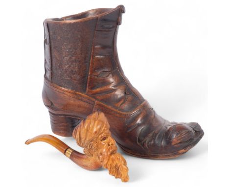 An early 20th century carved treen boot, H16cm, and a Meerschaum pipe with a bowl in the form of a Sultan's head (stem broken
