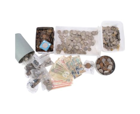 A large collection of coins, including British pre-decimal coins with silver content, Vintage world banknotes, commemorative 