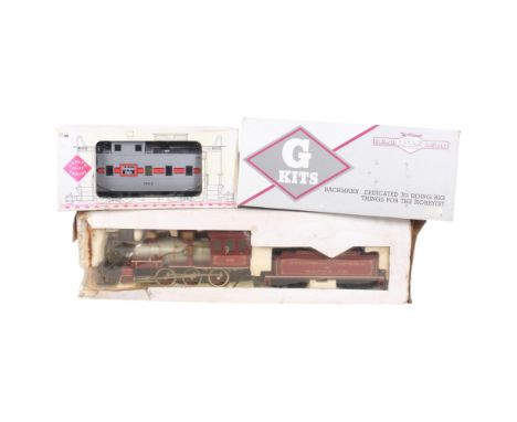 3 boxed locomotive, Aristocraft Burlington Route train, G Kits Bachmann, and an Aitchison Topeka Santa Fe locomotive and tend