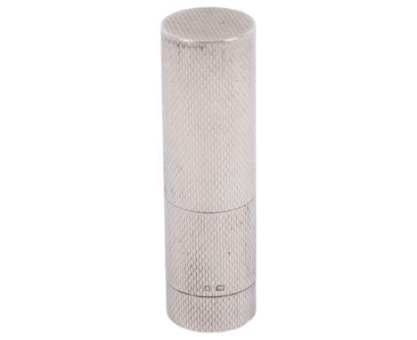 A sterling silver engine turned lipstick holder