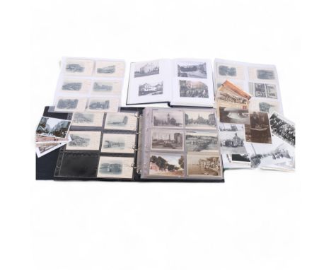 A postcard album with over 200 Vintage postcards of Hastings, together with a folder of reprinted photographs all depicting H