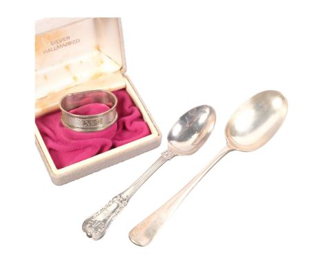 A boxed silver napkin ring, silver tablespoon, and teaspoon