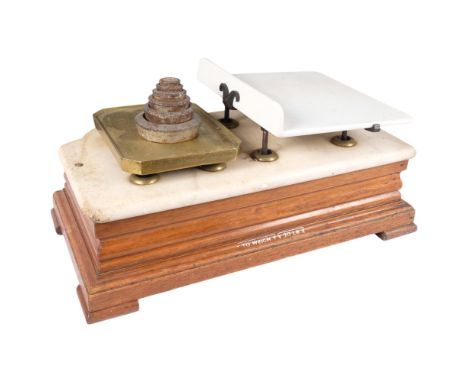 A set of Victorian grocery scales, ceramic and brass weighing plate, with marble top and wooden base, unmarked, set of weight