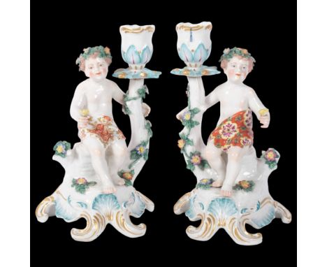 A pair of Vintage Continental porcelain candlesticks, with children figures, H19.5cm