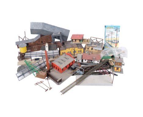 An Atlas HO scale model railway set, with track, wagons, buildings and accessories