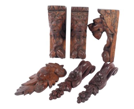 A group of 3 x 19th century carved lion corbel bracket supports, and a selection of similar carved supports, each fruit and f