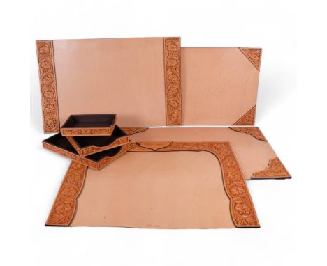 A graduated set of 3 tan tooled leather desk trays, longest 38cm, together with 4 tan tooled leather-mounted desk blotters, l