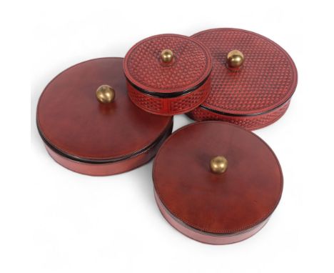 2 pairs of leather circular boxes and covers, 1 pair being of a woven wicker design, diameter 27cm, all from the workshop of 