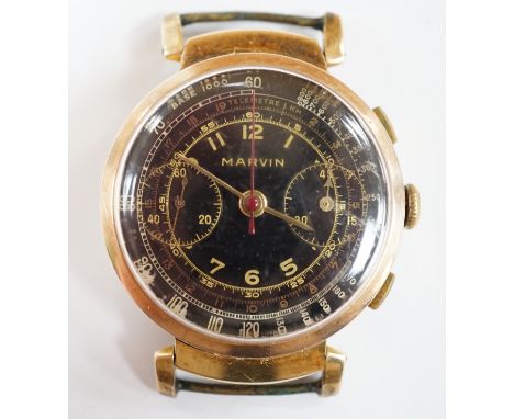 A gentleman's gilt metal Marvin chronograph manual wind black dial wrist watch, no strap, case diameter 36mm.