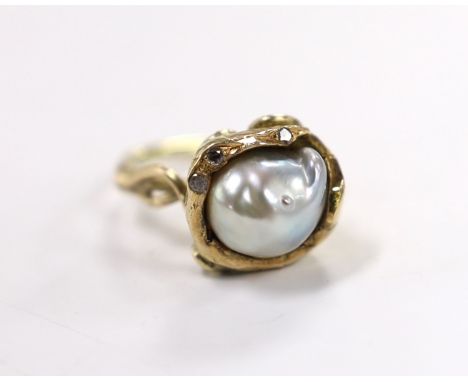 A yellow metal and baroque pearl set ring, with three stone diamond chip set setting, of foliate form, size K, gross weight 6