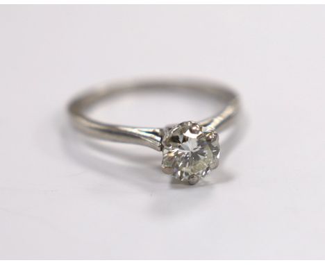 A white metal (stamped plat) and solitaire diamond set ring, size L/M, gross weight 3.5 grams, the stone with a diameter of 6