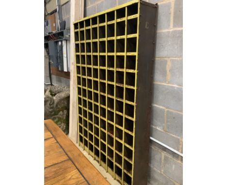 A vintage industrial painted metal pigeonhole unit, width 123cm, depth 23cm, height 184cm
