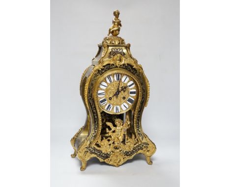 A large Louis XV style cut brass inlaid mantel clock, with a two train, French movement, striking on a bell, 50cm high