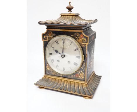 A George V chinoiserie lacquered mantel clock, decorated in relief with figures and pagodas, dial inscribed Birch &amp; Gaydo