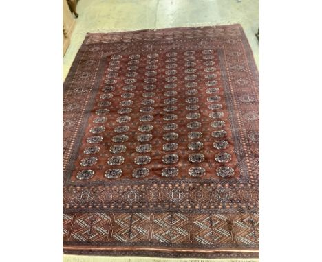 A Bokhara red ground carpet,310 x 237cm