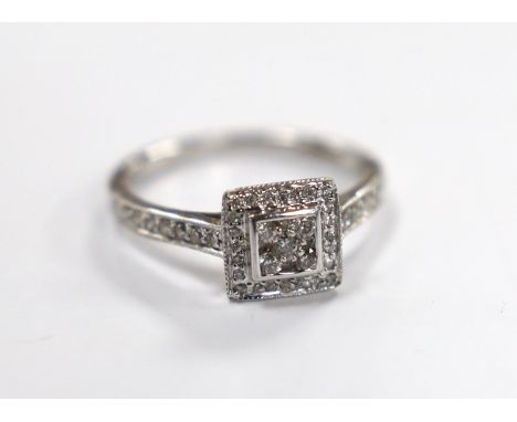 A modern 18ct white gold and diamond cluster set tablet ring, size J, gross weight 2.3 grams.