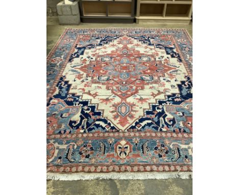 A Heriz ivory ground carpet, 350 x 272cm