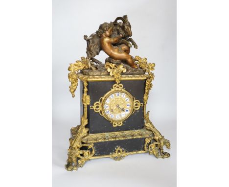 An early 20th century gilt-metal mounted mantel clock with bacchanalian group surmount, 44cm