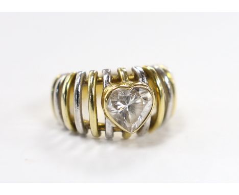 A modern pierced two colour 750 and single stone heart shaped simulated diamond set ring, size K, gross weight 9.4 grams.