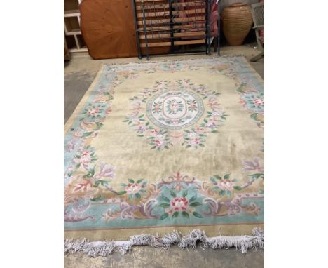 A Chinese gold ground carpet, 360 x 270cm