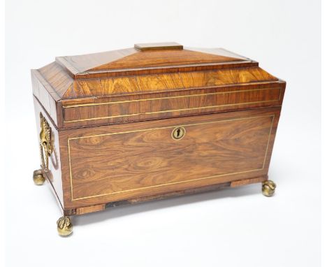 A Regency kingwood and brass strung sarcophagus tea caddy, manufacturers label for Staudenmeyer, 30 Cockspur Street, Charing 