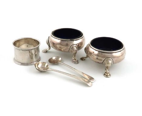 A pair of George II silver salt cellars,by James Stone, London 1734,circular cauldron form, on three hoof feet, with blue gla