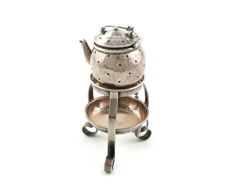 An American novelty silver tea infuser, modelled as a kettle on stand,  spot-hammered decoration, with a chain and ring, the 