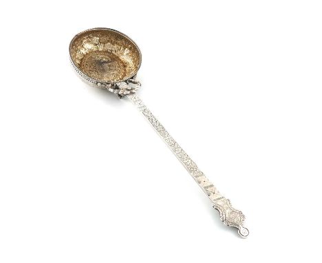 A Middle Eastern metalware ladle,the circular bowl chased with animals and foliate decoration, the handle chased with foliate