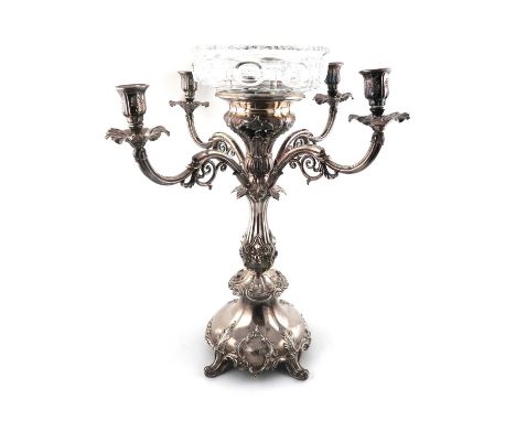 An early 19th century old Sheffield-plated four-branch candelabrum centrepiece,unmarked circa 1830,baluster column form, with