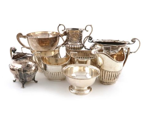 A mixed lot of silver items,various dates and makers, comprising: a cream jug and sugar bowl, Sheffield 1899, three fluted su