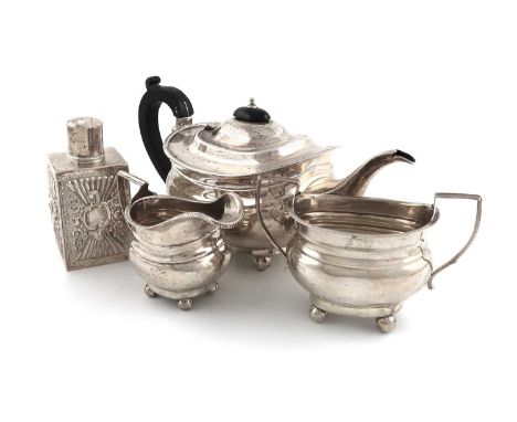 A three-piece silver tea set,by Henry Williamson Ltd., Birmingham 1920,oblong bellied form, gadroon border, plus a late-Victo