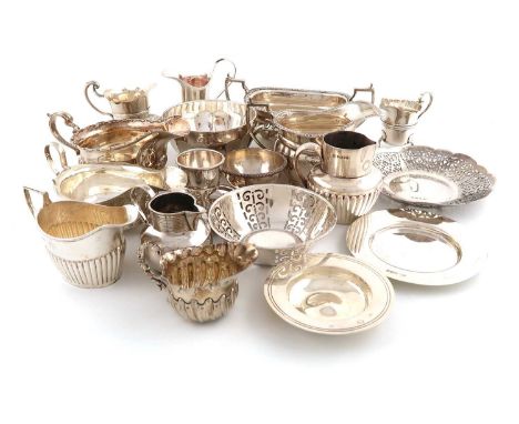 A mixed lot of silver items,various dates and makers,comprising: a cream jug and sugar bowl, seven small cream jugs, two sauc