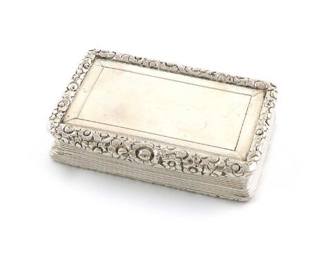 A George IV silver snuff box, by T. Shaw, Birmingham 1825, rectangular form, plain cover with a foliate border, reeded sides,
