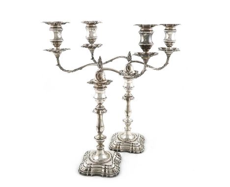 A pair of Edwardian silver two-light candelabra, by Fordham & Faulkner, Sheffield 1909, knopped baluster columns, spool-shape