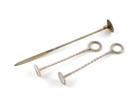 A Victorian silver-gilt sugar crusher,London 1849,with a circular base, ring attachment and spike terminal, plus a pair of Vi