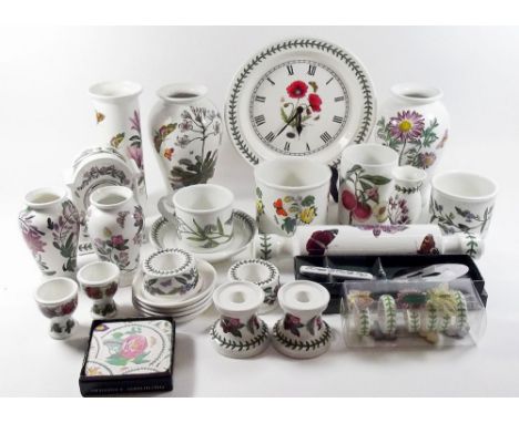 A collection of Portmeirion ceramics comprising six boxed coasters, six boxed napkin rings, a boxed cake/pastry server, four 