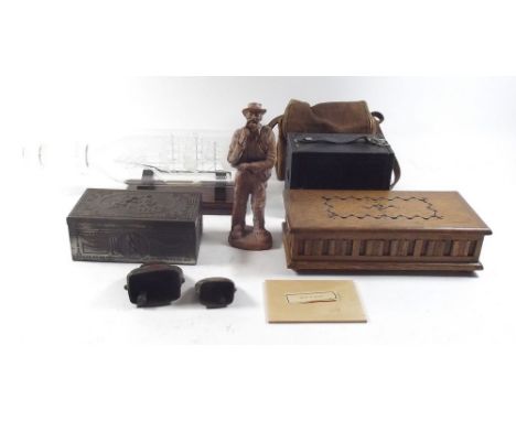 An Austrian carved wood figure of a walker and various collectables including cigarette cards 