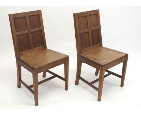 A pair of oak panel back church chairs 
