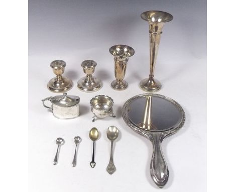 Two silver vases, a pair of silver candlesticks, a silver salt and mustard, silver and enamel spoon etc. 